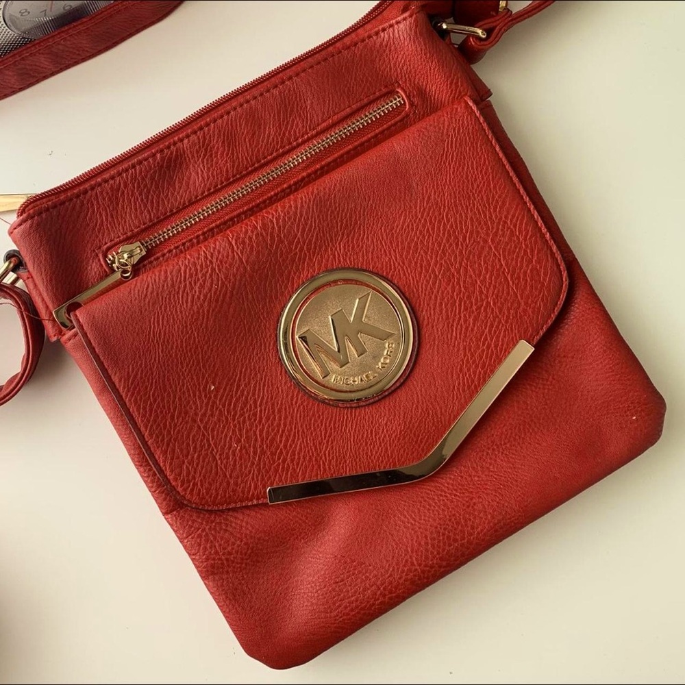 Red crossbody Micheal Kors bag